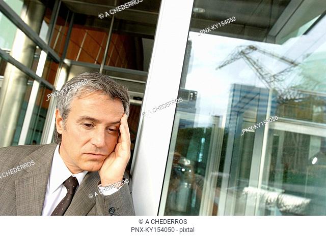 Businessman standing by window