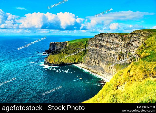 Cliffs of moher in county Clare, Ireland. One of the most popular tourist destinations. Sunny summer day