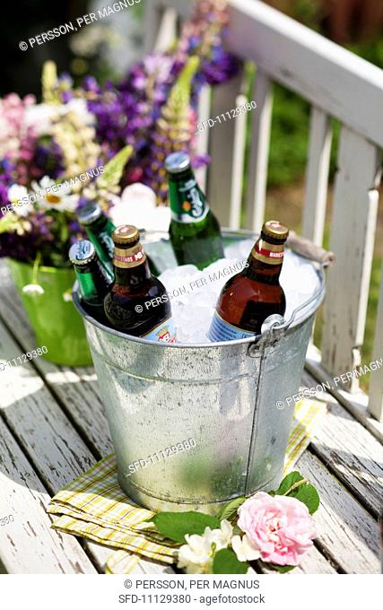 Beer and lemonade in an ice bucket
