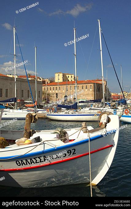 Traditional boats and luxury sailing boats inside the harbor in Chania city, Chania Province, Crete, Greek Islands, Greece, Europe