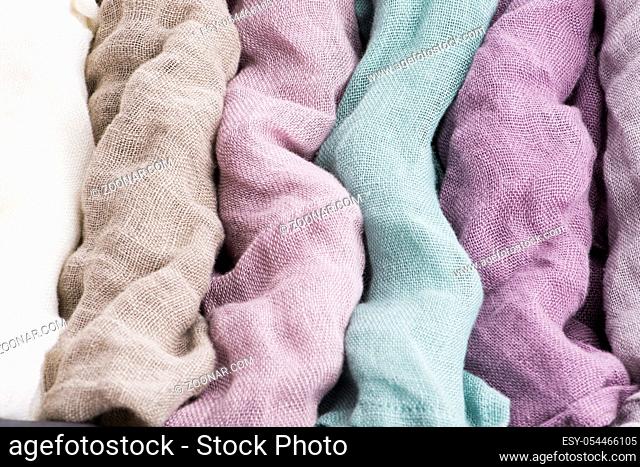 Multicolored textile with violet tones and colorful accents and rich, detailed texture, flax