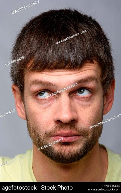 Closeup portrait of a pensive man of European appearance