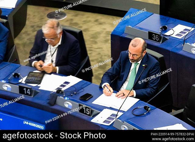 14 September 2022, France, Straßburg: Manfred Weber (r, CSU, EPP Group) sits in the European Parliament building and takes notes