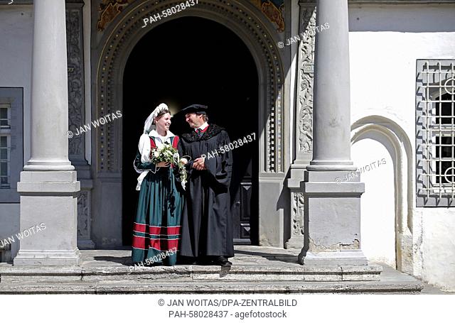This year's Luther couple Maria Jana Palaschevsky as Katharina von Bora and Fred Goede as Martin Luther stands on the stairs of the town hall of Lutherstadt...