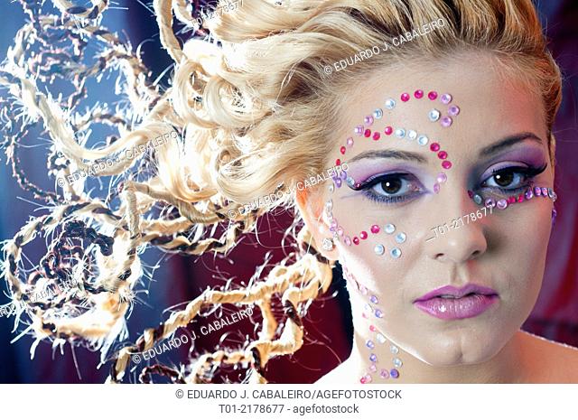 blond girl with fancy hairstyle and makeup