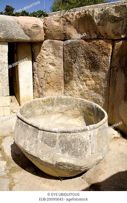 Large stone urn in the Tarxien archaeological site