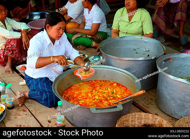 Woman prepare food for the monks at kampong Phulk, tonle sap lake, siem reap, cambodia