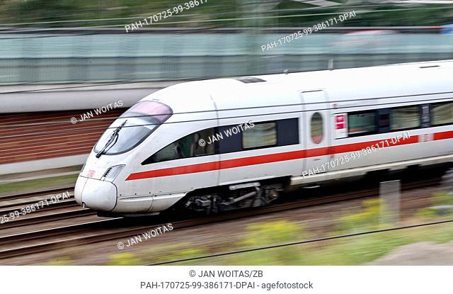FILE - A file picture dated 21 July 2016 shows an Intercity Express (ICE)Â train passing a construction site outside the main station in Leipzig, Germany