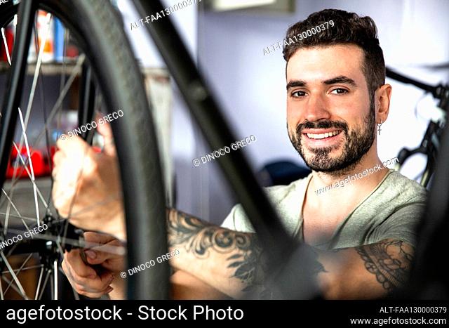 Mechanic tattooing Stock Photos and Images