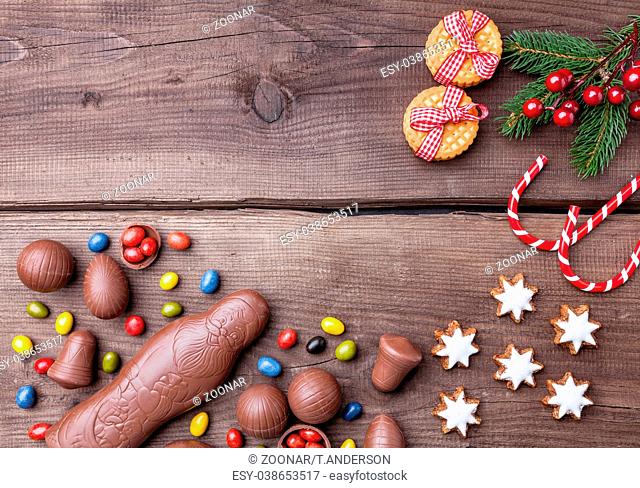 Festive Christmas wooden background with sweets and decoration