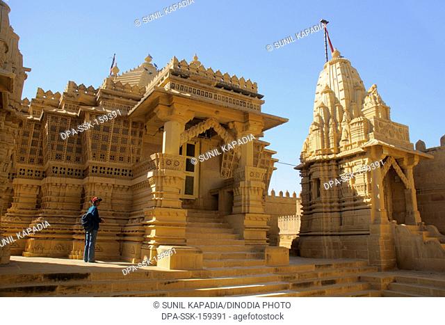 Beautifully carved Jain temple complex made by sandstones at Amarsagar Lake away from Jaisalmer ; Rajasthan ; India