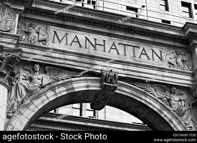 Word Manhattan on the old building facade in NYC, USA