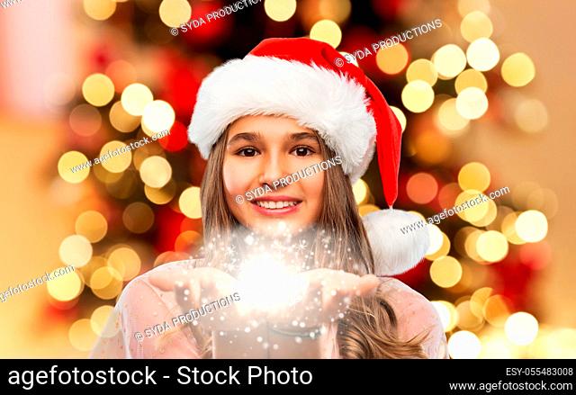 teenage girl with magical fairy dust on christmas