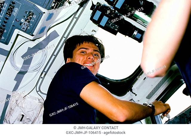 Astronaut Franklin R. Chang-Diaz, STS-61C mission specialist, while checking cargo in the space shuttle Columbia's payload bay