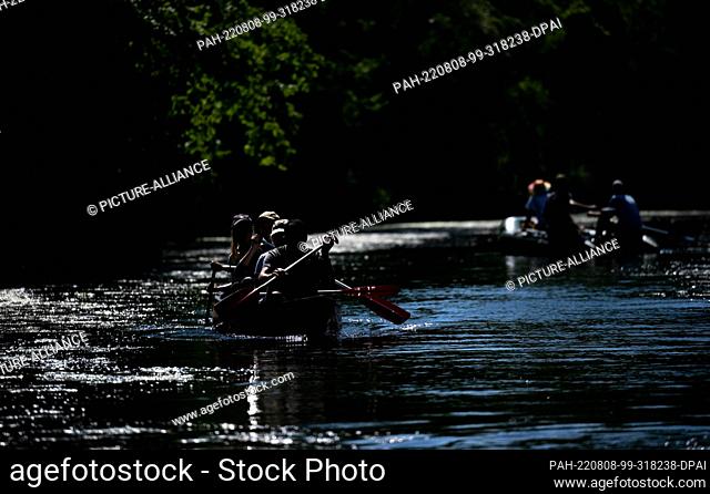 08 August 2022, Saxony, Leipzig: Paddle boats are underway on the Karl Heine Canal in Leipzig. The canal in the middle of the city is a popular place for...