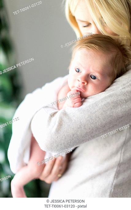 Woman holding her baby son