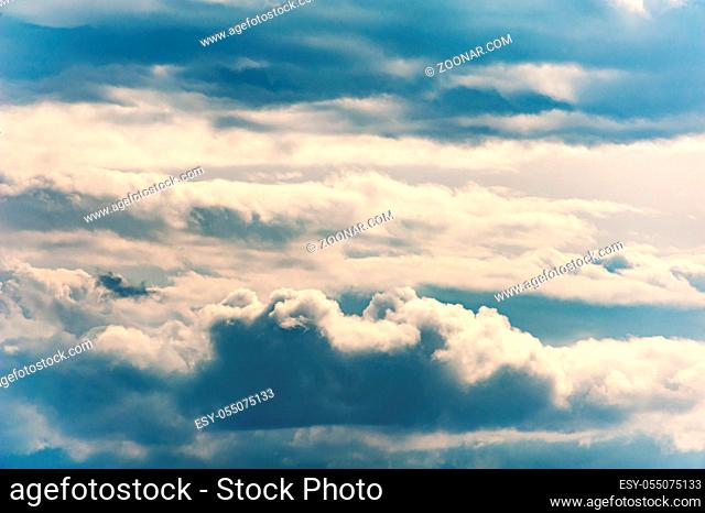 Natural sky composition. Sunny vast blue sky abstract background. Beautiful cloudscape, view over white fluffy clouds. Element of design