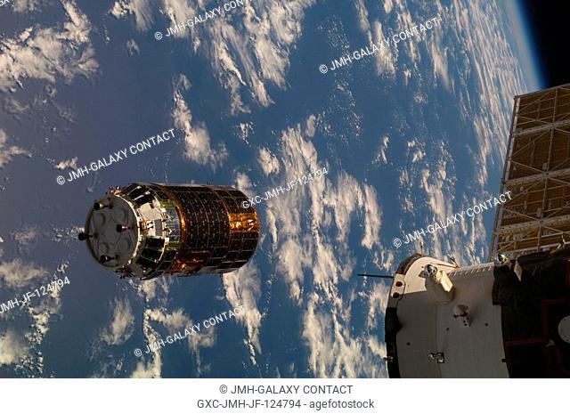 Backdropped by a blue and white part of Earth, the unpiloted Japanese H-II Transfer Vehicle (HTV) approaches the International Space Station