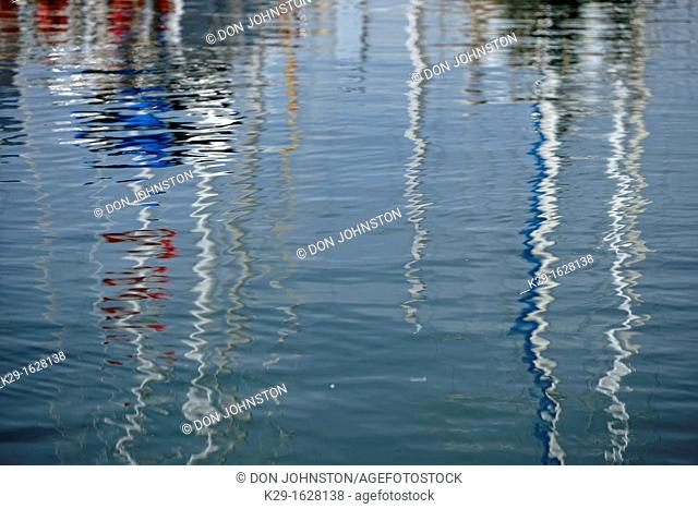 Reflections of boats in the Inner Harbour waters Victoria, BC