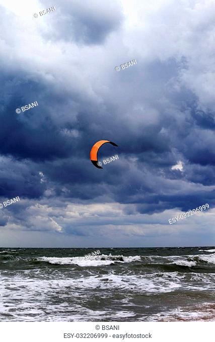 Power kite at windy sky before rain