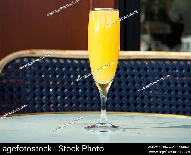 PRODUCTION - 06 October 2023, France, Paris: A Mimosa cocktail stands on the table of a bar. The cocktail made of orange juice and champagne may have been...