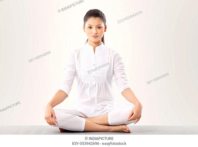 Portrait of young woman doing yoga