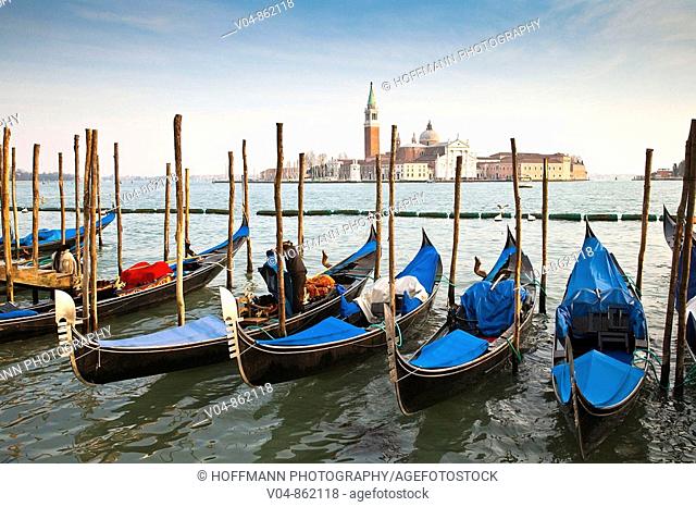 Several gondolas moored in front of San Giorgio Maggiore in Venice, Italy, Europe