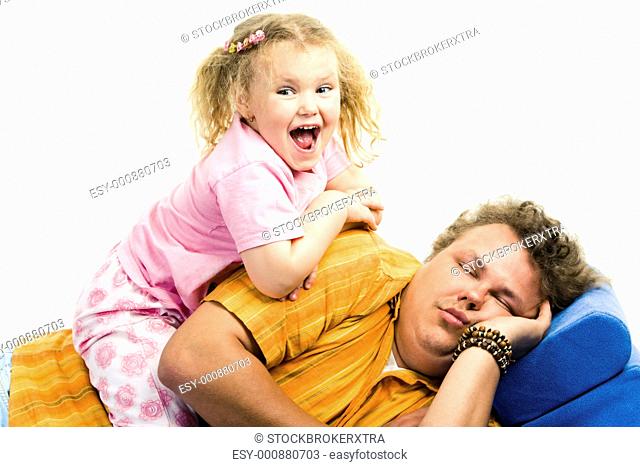 Portrait of girl sitting on her daddy and screaming