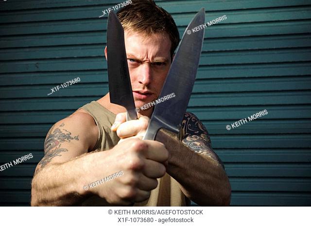 Aggressive 30 year old man with knife