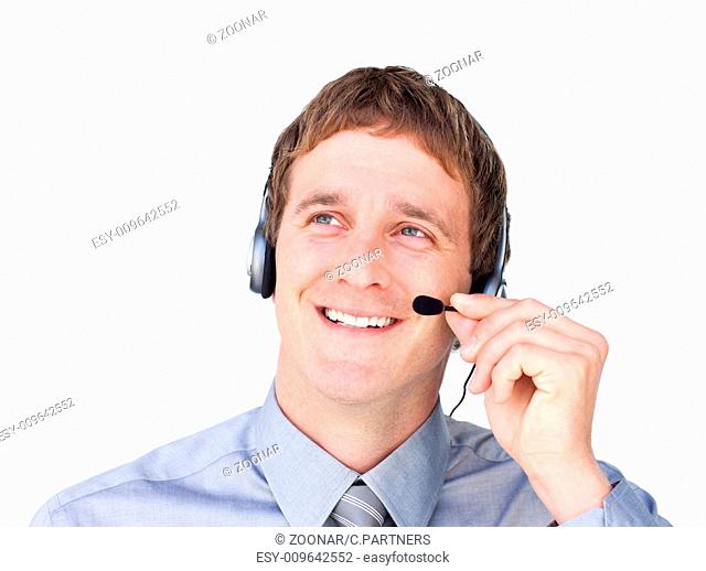 Assertive businessmnan with headset on looking up against a white background