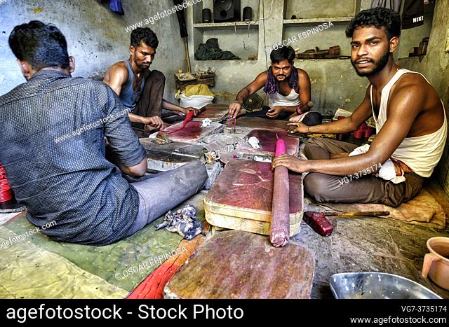 Bundi, India - August 2020: Men making bracelets in a small workshop in the old town of Bundi on August 10, 2020 in Bundi, Rajasthan. India