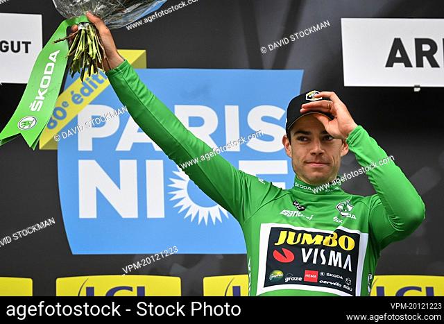 Belgian Wout Van Aert of Team Jumbo-Visma celebrates on the podium in the green jersey of leader in the sprint ranking after the fifth stage of 80th edition of...