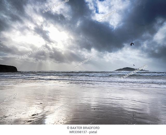 A kitesurfer off the beach at Bantham during a storm, near Kingsbridge, Devon, England, United Kingdom, Europe