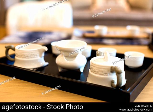 elegant ceramic tea sets on table in modern living room