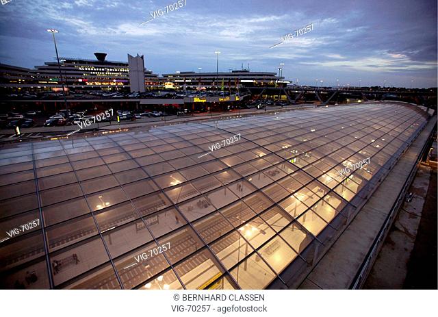 New railway station of the Deutsche Bahn AG with modern glass roof at the Konrad-Adenauer airport Cologne / Bonn, at the back the Terminal 1