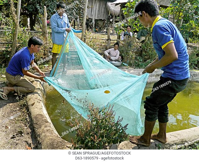 CAMBODIA. Projects of DPA in Stung Treng, supported by SCIAF. Katot village. Case study of Mrs Thong Leung, 35, who has a fish pond  Leung's cousin Ngon Savan...