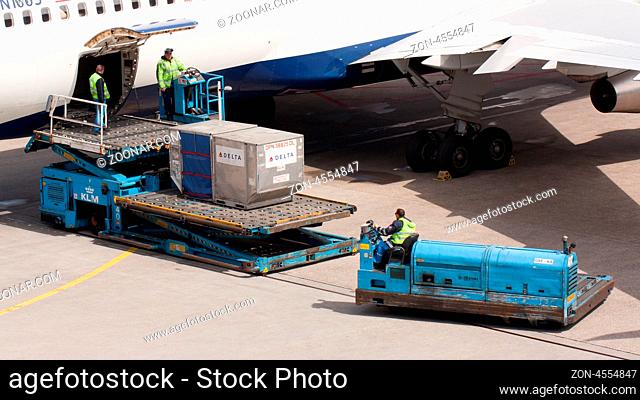 AMSTERDAM - MAY 11: Boeing 767-332ER of Delta is being loaded by ground personal before taking off from Schiphol airport located in Amsterdam, on May 11, 2012