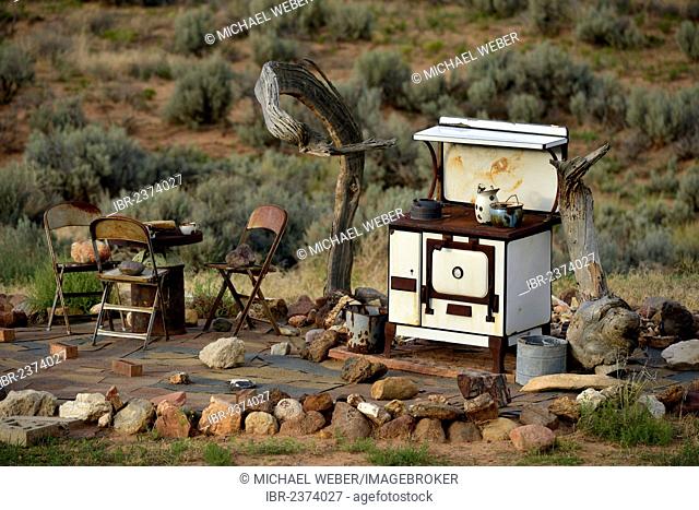 Rusty oven and sofa placed in the desert, near Escalante, Grand Staircase-Escalante National Monument, GSENM, Utah, Southwestern United States, USA