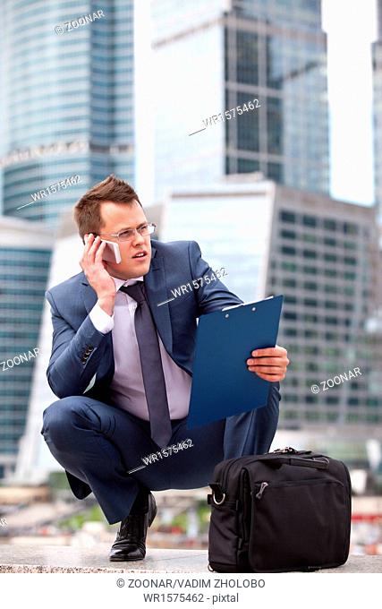 Successful businessman holding a planning