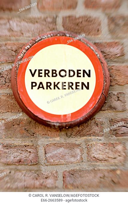 No parking sign (in Dutch) on building near the 1992 Plein in Maastricht. Shot with LensBaby for selective focus
