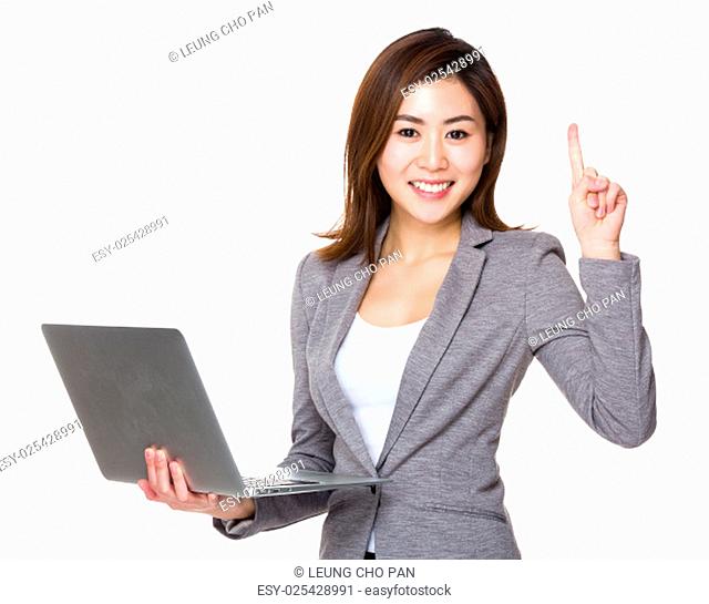 Businesswoman hold with laptop and finger up