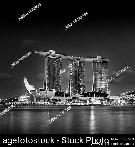 Marina Bay in Singapore with Marina Bay Sands Hotel and ArtScience Museum at night