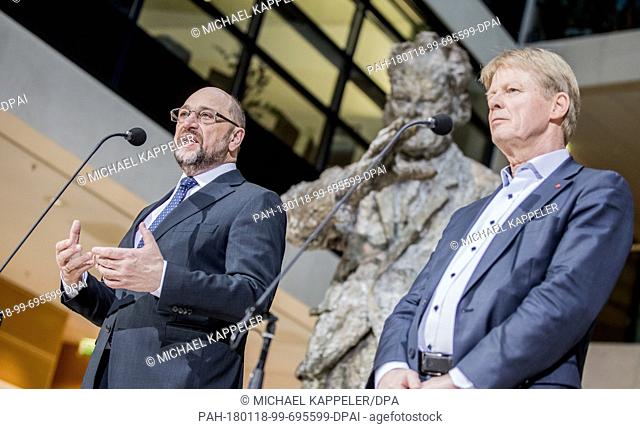 Martin Schulz, leader of the German Social Democratic Party, talks next to Reiner Hoffmann, chairman of the DGB, during a press conference at the SPD...