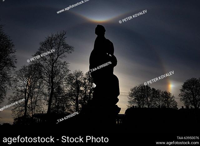 RUSSIA, ST PETERSBURG - OCTOBER 26, 2023: A Sun halo is seen over a statue of Andromeda at the Tsarskoye Selo museum estate, outside St. Petersburg
