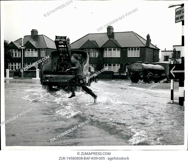 Aug. 08, 1958 - Torrential Rains beings many floods. Waves in Eltham - London : Photo shows The scene at Eltham, London - yesterday -as a boy leaps into the...