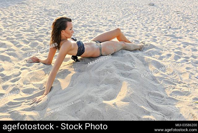 Young woman, 20+, lies on the beach, summer, lifestyle, Niendorf on the Baltic Sea, Schleswig-Holstein, Europe
