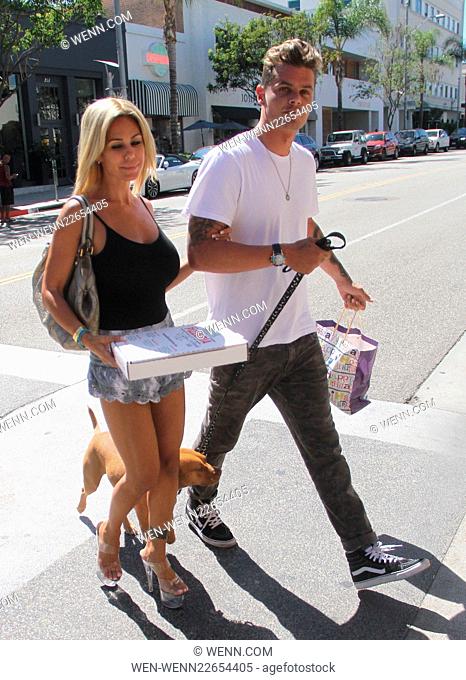 Former Playboy Playmate Shauna Sand wears lucite platform heels to pick up pizza with her husband Stevie Simpson Featuring: Shauna Sand