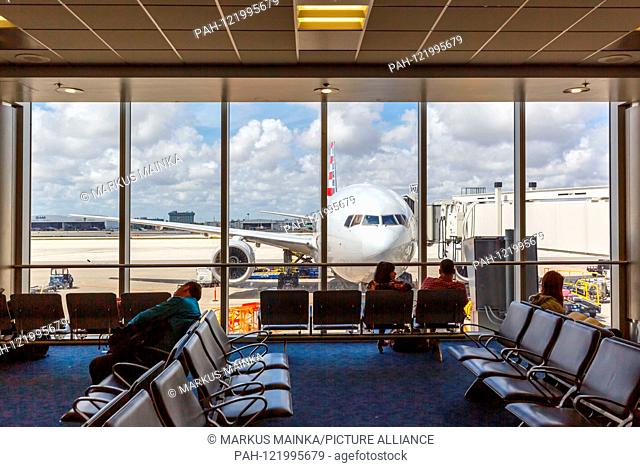 Miami, Florida – April 7, 2019: Symbolic picture aviation passengers American Airlines airplane at Miami airport (MIA) in the United States