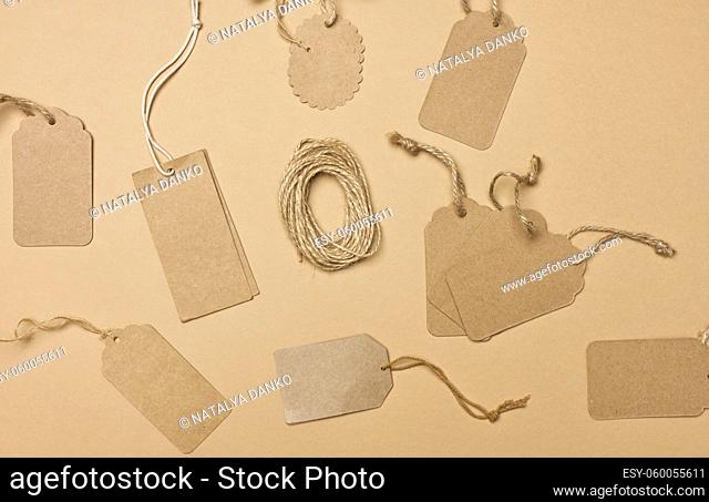 blank brown rectangular, round brown paper tag on a rope isolated on white background, template for price, discount