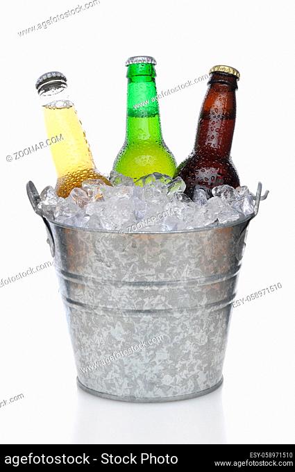 Three Different Beer Bottles in bucket of ice with condensation vertical composition over white background